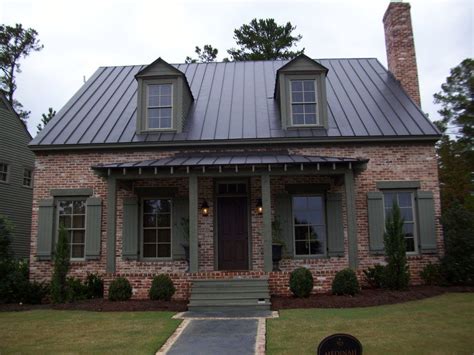 painted brick house with metal roof|homes with brown metal roofs.